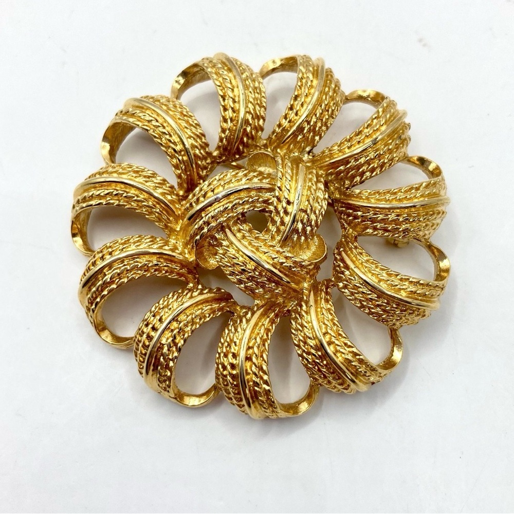 Vintage Monet Gold-Tone Galaxy Spinning Wheel Braided Ribbon Floral Brooch